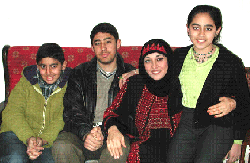 A Palestinian family smiles for the camera.