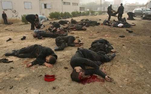 Many bodies lie outside the Hamas police headquarters following an Israeli air strike in Gaza City on December 27, 2008. (MOHAMMED ABED/AFP/Getty Images)