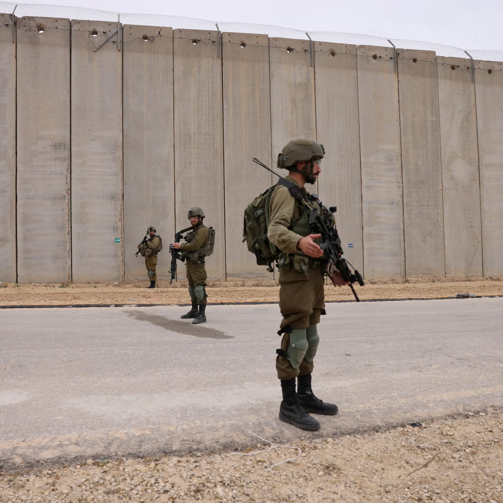 Israeli soldiers guarding Gaza border wall