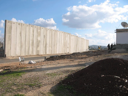 Photo of the wall, which separates the Amer family from the rest of their town.