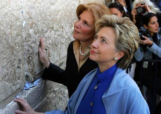 Sen. Hillary Rodham Clinton (D-N.Y.) lays her hands on the stones of Jerusalem's Western Wall Nov. 14, 2005.